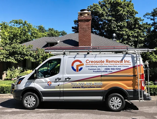 Weston Chimney Sweep technician removing creosote safely in Weston, MA