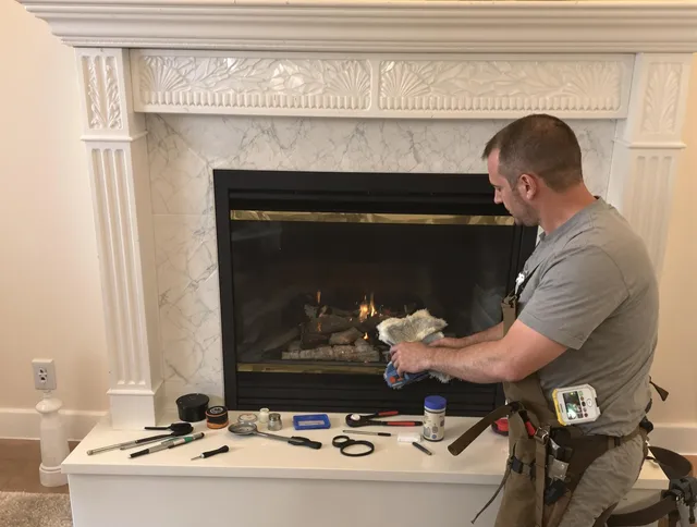 Weston Chimney Sweep performing fireplace maintenance in Weston, MA