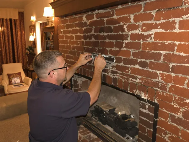 Weston Chimney Sweep expert fixing a fireplace in Weston, MA